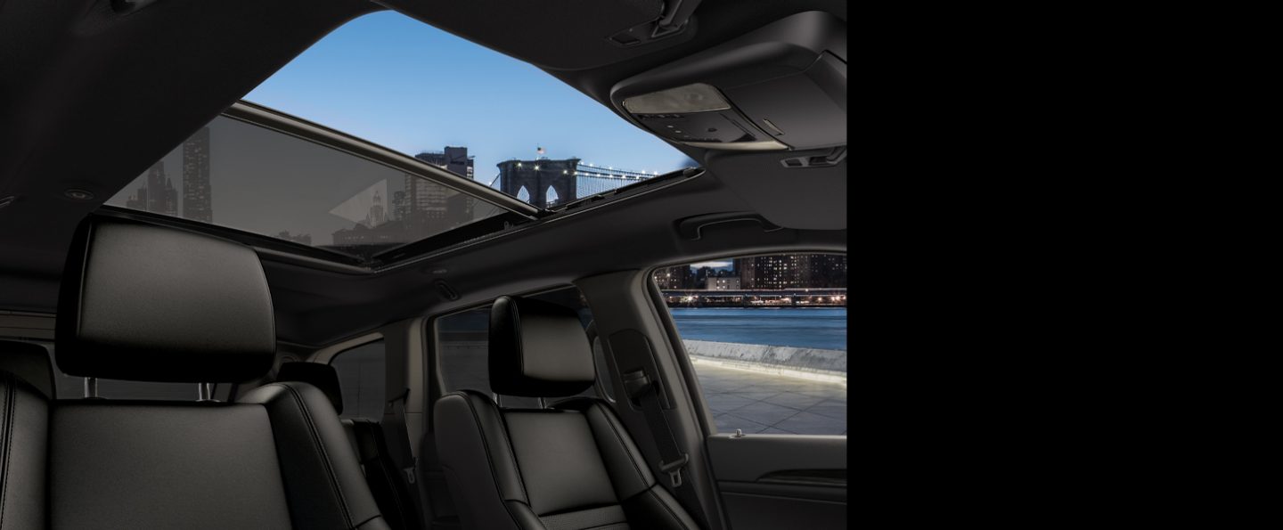 An interior view of the CommandView sunroof on the 2020 Jeep Grand Cherokee Limited X with the front pane open.